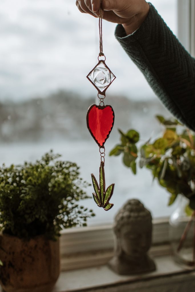 person holding a cannabis charm